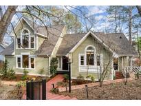 Charming home featuring a manicured lawn, brick walkway, and well-maintained exterior at 315 Westbrook Dr, Carrboro, NC 27510