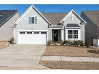 Charming single-Gathering home with a well-manicured lawn and an attached two-car garage at 106 Ivory Ln, Raleigh, NC 27610