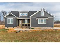 New construction home featuring gray siding, a welcoming porch and well-placed windows at 1371 Antioch Church Rd, Timberlake, NC 27583