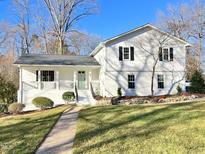 Charming, freshly renovated two-story home with a landscaped yard and inviting front porch at 2115 Port Royal Rd, Raleigh, NC 27609