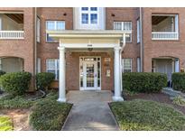 Brick building with white door and columns in front of entrance 1700 at 1700 Tiffany Bay Ct # 303, Raleigh, NC 27609