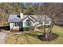 Charming single-story home with manicured lawn, mature trees, and inviting front entrance at 2204 Gentry Dr, Durham, NC 27705