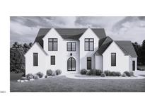 Striking exterior elevation showcasing modern design with dark windows and a well-manicured lawn at 297 Colonial Ridge Dr, Pittsboro, NC 27312