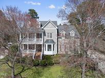Charming two-story home boasts inviting curb appeal with manicured landscaping and a classic architectural design at 318 Belles Landing Ct, Cary, NC 27519