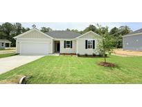 Charming single story home with a 1 car garage, well kept lawn and landscaping at 158 Gobbler Dr, Smithfield, NC 27577