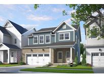 Charming two-story home with a brick facade, attached garage, and covered front porch in a suburban neighborhood at 287 Beacon Dr, Pittsboro, NC 27312