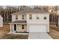 Charming two-story home with attached garage and well-maintained landscaping at 538 E Waycliff Rd, Henderson, NC 27537
