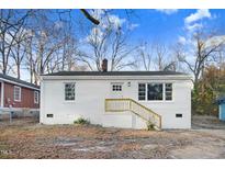 Charming one-story home with a brick chimney and freshly painted white exterior at 916 Tyan St St, Rocky Mount, NC 27801