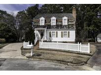 Charming two-story home with white picket fence and well-maintained landscaping at 104 Province Cir, Rocky Mount, NC 27804