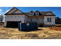 New home with unfinished exterior and dumpster in front at 28 Golden View Pl, Zebulon, NC 27597