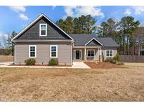 Charming single-Gathering home with a modern exterior and well-maintained landscaping at 649 Pendergrass Rd, Sanford, NC 27330