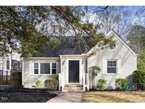 Charming home featuring classic brickwork, complemented by well-manicured shrubs at 1304 N Duke St, Durham, NC 27701