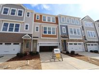 New construction townhome featuring multiple stories, attached garages, and landscaped front yards at 2323 Bay Minette Sta # 547, Apex, NC 27502