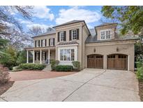 Beautiful brick home featuring a two-car garage and covered front porch at 705 Glen Eden Dr, Raleigh, NC 27612