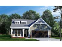 Charming single-story home featuring a welcoming front porch, dormer windows, and a convenient attached two-car garage at 13341 Nc 27 Hwy, Broadway, NC 27505