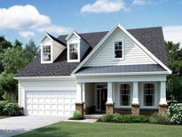 Charming single-Gathering home featuring a two-car garage, covered porch, and dormer windows at 1421 Sparkling Lake Dr # 61, Apex, NC 27523