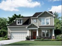 Charming two-story home showcasing a covered porch, attached garage, and a well-maintained front yard with lush greenery at 1439 Sparkling Lake Dr # 64, Apex, NC 27523