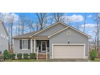 Charming single-story home with a two-car garage and landscaped front yard at 1600 Frog Hollow Way, Wake Forest, NC 27587