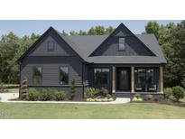 Charming two-story home featuring a manicured lawn and inviting front porch at 33 Henry Ct, Chapel Hill, NC 27516