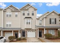 Charming townhome featuring neutral siding, a bay window, and a single-car garage at 650 Ganyard Farm Way # 4, Durham, NC 27703