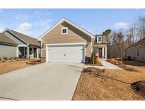 Charming single Gathering home featuring a two-car garage and beautiful curb appeal at 2109 Flycatcher Ln, Fuquay Varina, NC 27526