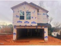 Two-story home under construction features a spacious two-car garage and a modern design at 110 W Kitchin St, Burlington, NC 27215