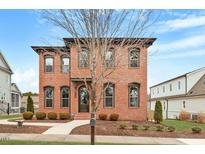 Charming brick two-story home with well-manicured landscaping and a classic facade at 1354 Briar Chapel Pkwy, Chapel Hill, NC 27516