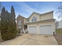 Charming two-story home with a brick accent and a two-car garage at 4 Birkdale Ct, Durham, NC 27713