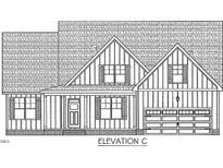 Charming exterior elevation showcasing a craftsman-style home with a two-car garage and inviting front porch at 45 Yellowstone Ct, Youngsville, NC 27596