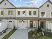Charming new construction townhome with attached garage and beautifully landscaped front yard at 716 Jamescroft Way # 28, Rolesville, NC 27571