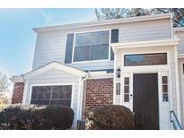 Charming two-story home with brick accents and well-maintained landscaping at 7708 Falcon Rest Cir, Raleigh, NC 27615