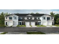 Charming townhome exteriors featuring light color palettes, attached garages and well-manicured lawns at 10526 Brookside Reserve St, Raleigh, NC 27614