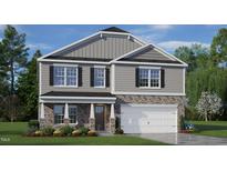 Charming two-story home features stone accents, gray siding, a two-car garage and a covered front porch at 112 Pisgah St, Sanford, NC 27330