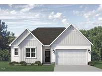 Charming one-story home featuring white siding, a two-car garage, and a welcoming front entrance at 338 Tormore Dr, Homesite 123, Sanford, NC 27330
