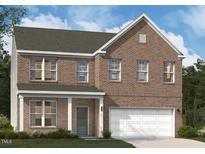 Charming two-story brick home with an attached garage and a covered front porch, offering classic curb appeal at 3205 Shannon Woods Lane # 20, Apex, NC 27523