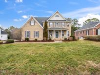 Charming two-story brick home with manicured lawn and inviting front porch at 2639 Bowden Dr, Creedmoor, NC 27522