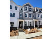 Newly constructed multi-Gathering townhome in a desirable community with modern architectural details at 3009 Honeymyrtle Ln, Durham, NC 27703