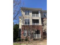 Inviting condo building with brick facade and charming balconies, offering a blend of classic and modern design elements at 421 Glencrest Pl, Chapel Hill, NC 27514