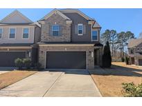 Charming two-story home with a two-car garage and inviting brick and siding exterior at 1015 Rexburg Dr, Cary, NC 27513