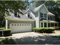 Charming two-story home featuring a front-facing two car garage and traditional architectural elements at 1501 Ramson Ct, Raleigh, NC 27603