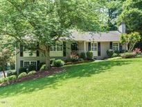 Beautiful home with a well-manicured lawn, professional landscaping, and inviting curb appeal at 2001 Manuel St, Raleigh, NC 27612