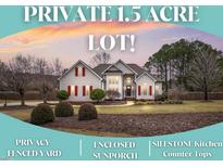 Charming two-story home boasts mature landscaping and a private 1.5 acre lot at 3112 Gold Dust Ln, Willow Springs, NC 27592