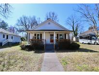Charming bungalow featuring a covered front porch and walkway to the entry at 333 Albright Ave, Graham, NC 27253