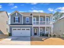 Charming two-story home with a covered porch and a two-car attached garage at 3381 Lovage Drive Dr, Apex, NC 27502