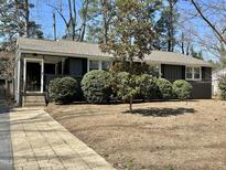 Charming single-story home featuring a landscaped front yard and a welcoming entrance at 416 Hickory Dr, Chapel Hill, NC 27517