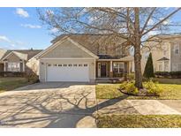 Charming two-story home with a two-car garage, landscaped yard, and inviting front porch at 778 Cabin Branch Dr, Fuquay Varina, NC 27526
