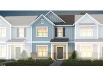 Charming townhome featuring eye-catching exterior, gray siding, and a welcoming covered entry at 387 Fosterton Cottage Way, Raleigh, NC 27603
