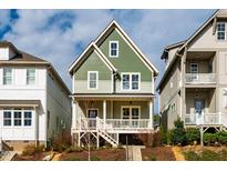 Charming two-story home with a welcoming front porch and landscaped yard at 650 Great Ridge Pkwy, Chapel Hill, NC 27516