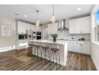This spacious kitchen features a large island, modern appliances, and stylish pendant lighting at 1912 Harrell Cove Ct # 171 Gunnison Cr, Fuquay Varina, NC 27526