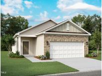 Charming single-Gathering home featuring a two-car garage, manicured lawn, and a welcoming entrance at 1153 Solace Way, Rolesville, NC 27571